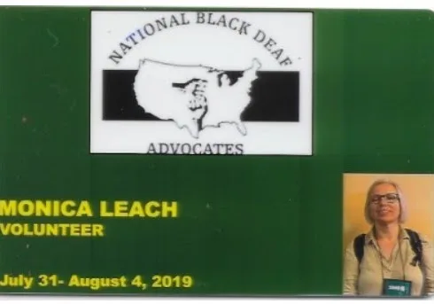 Volunteer name badge for Monica Leach at the USA National Black Deaf Advocates Conference, Oakland, 2019