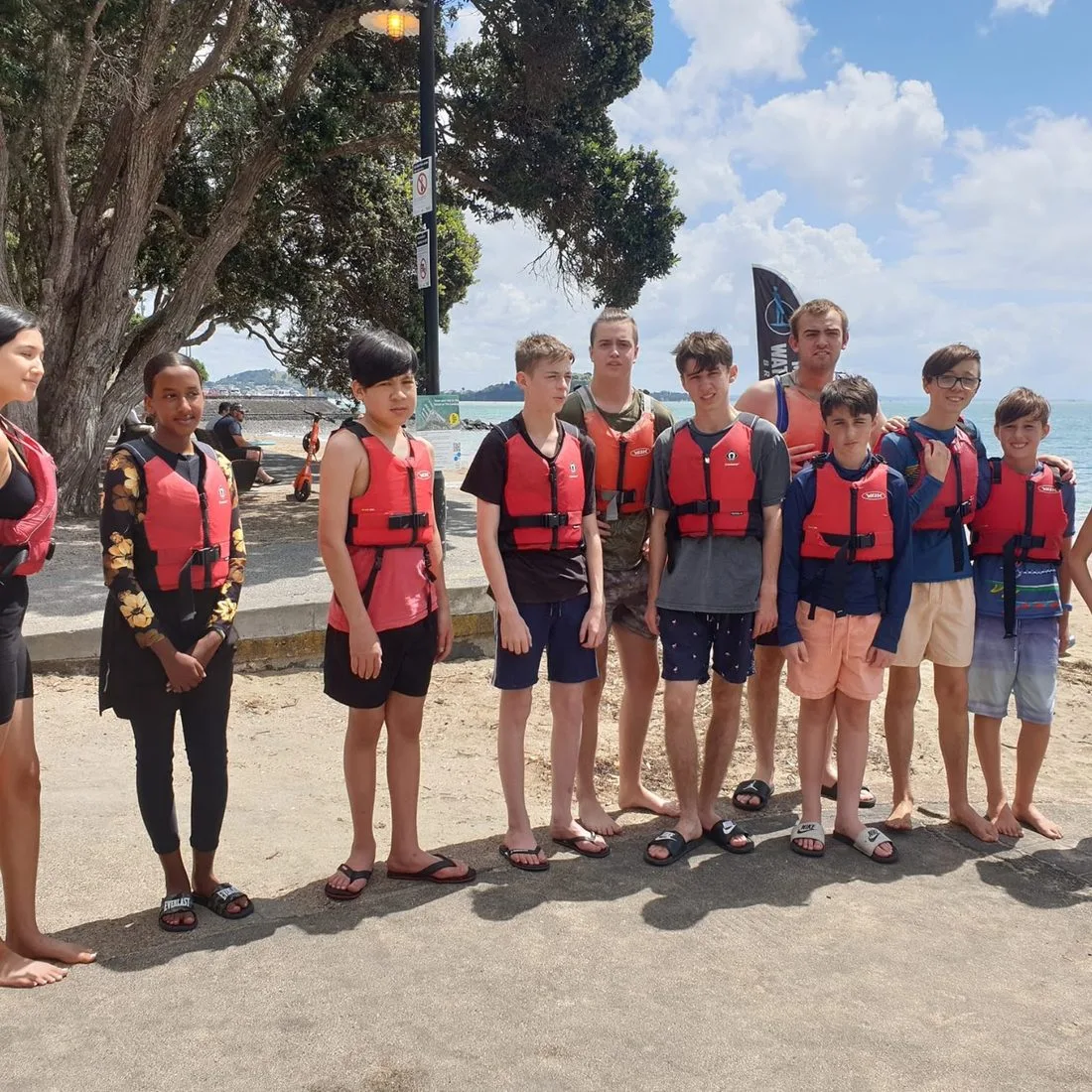 CODA youth in life jackets before sea kayaking